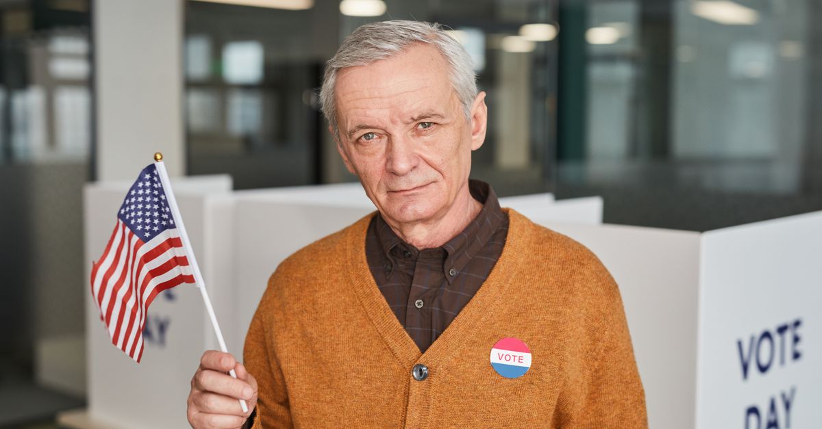 Elderly man with American flag and vote sticker in polling station. Emphasizing civic duty and participation.